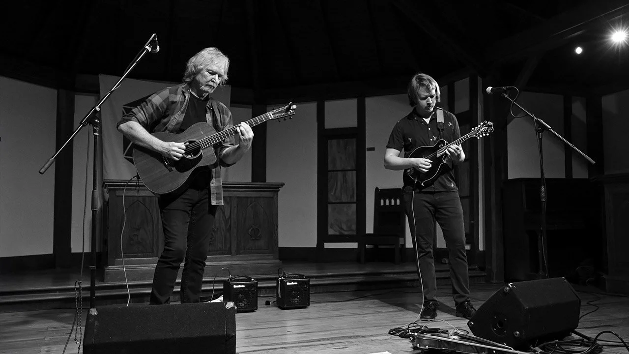Black and White image of Tim & Myles Thompson playing live