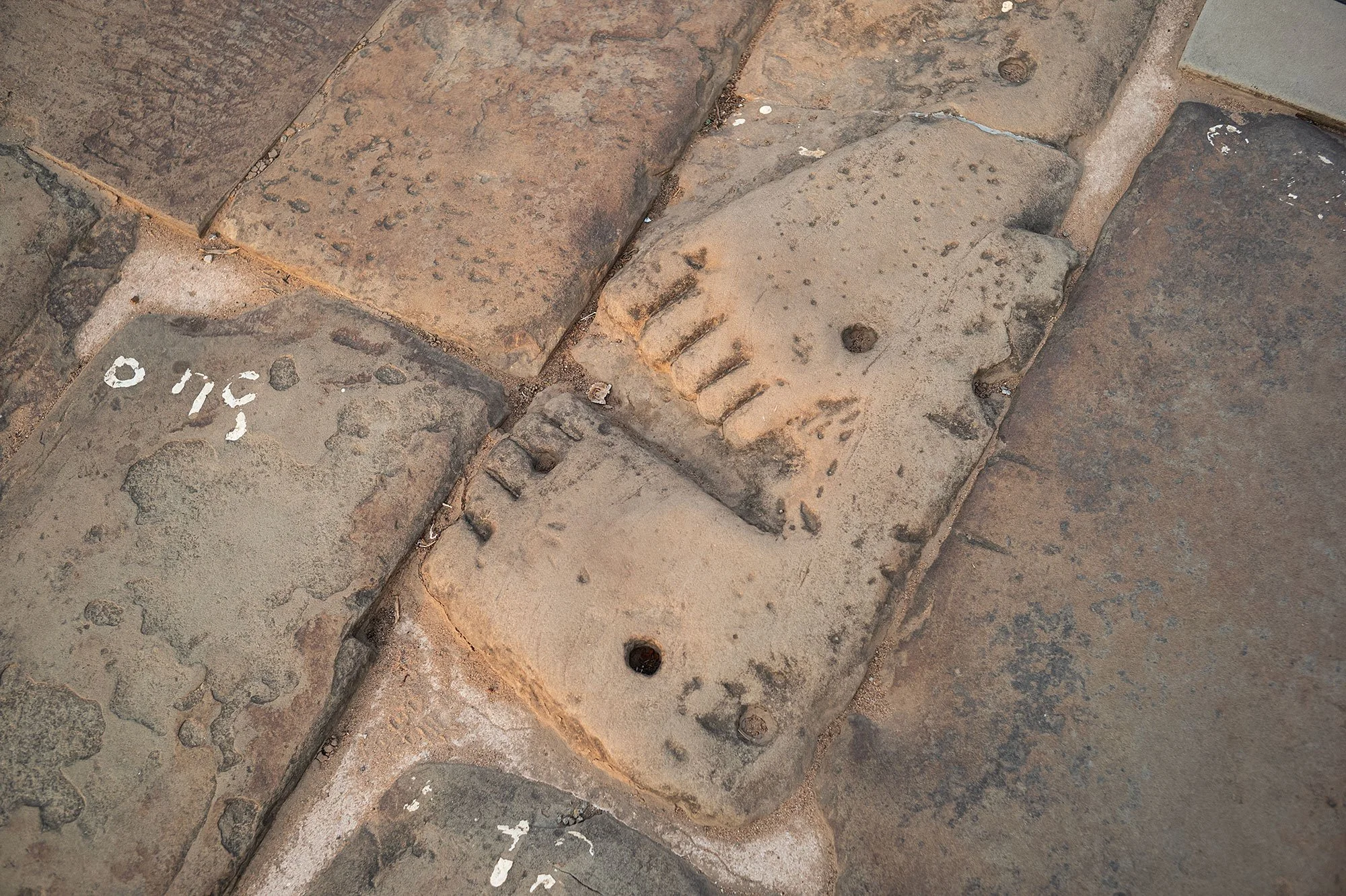 Feet carved into the causeway leading to Angkor Wat, Cambodia
