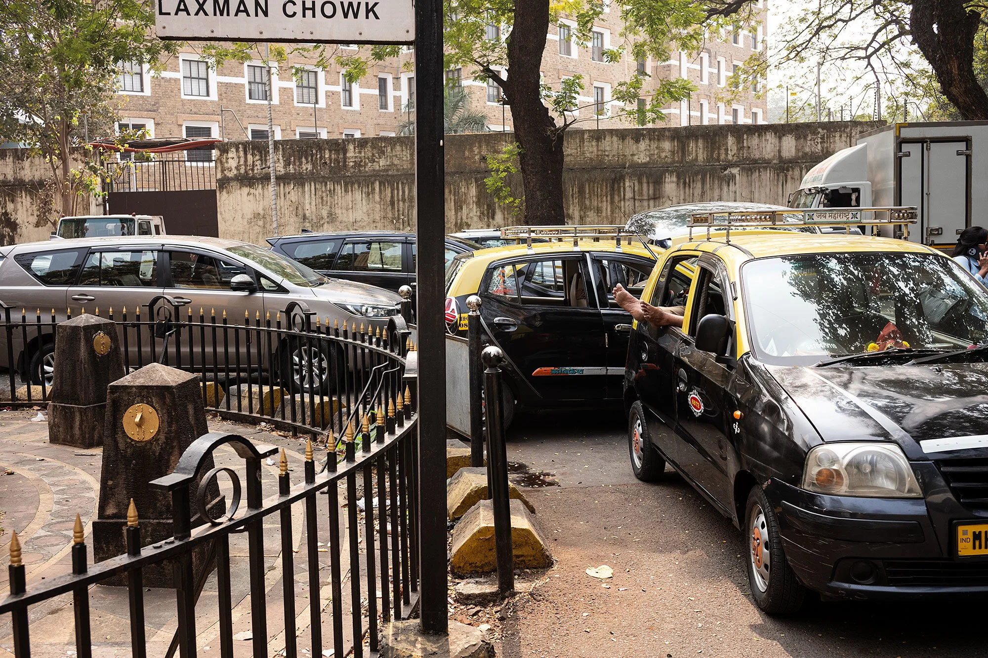 A taxi driver resting his feet. Mumbai, India.
