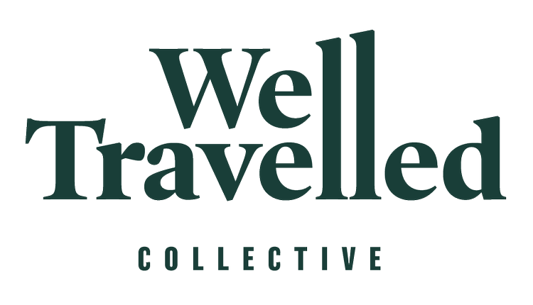 Logo with the words 'Well Travelled' and 'Collective' underneath.