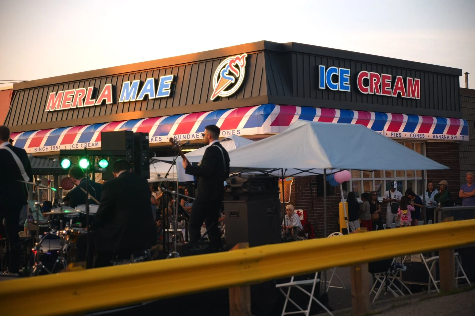 Turning Corners performing in the Merla-Mae parking lot at National Ice Cream Day 2026