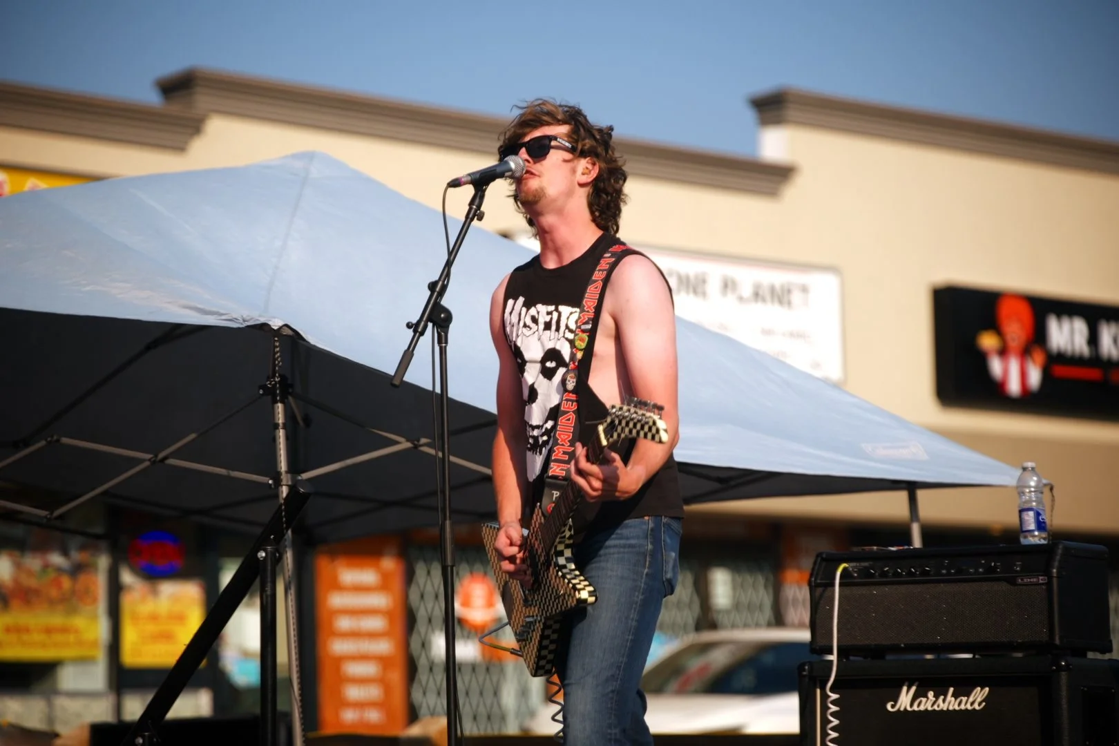 Full Throttle's guitarist performing at Merla-Mae's National Ice Cream Day 2026 in London, Ontario