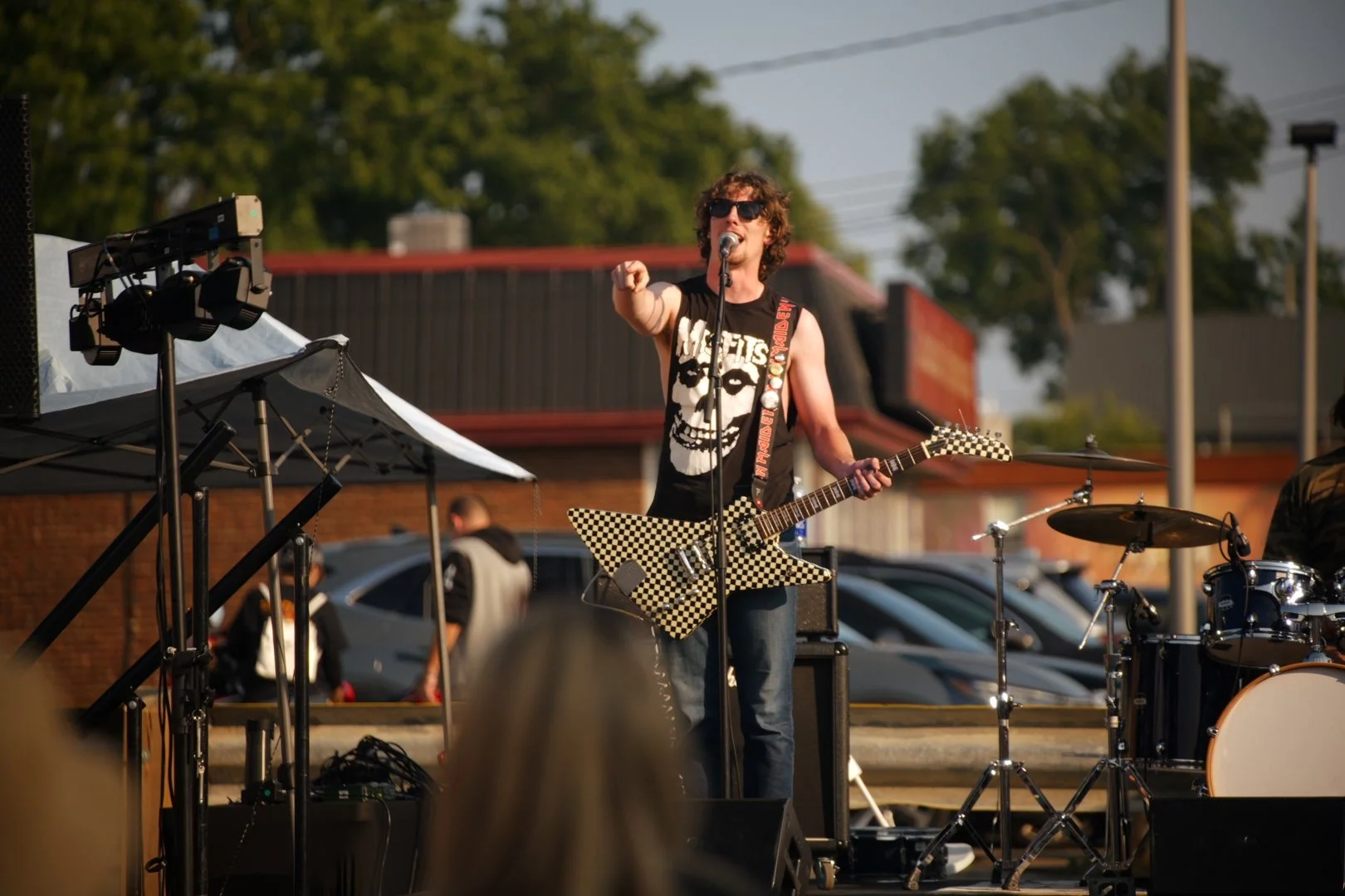 Full Throttle's guitarist with his checkered electric guitar at National Ice Cream Day 2026, Merla-Mae