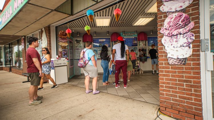 Guests lined up at the walk-up ordering windows at National Ice Cream Day 2025, Merla-Mae Ice Cream in London, Ontario