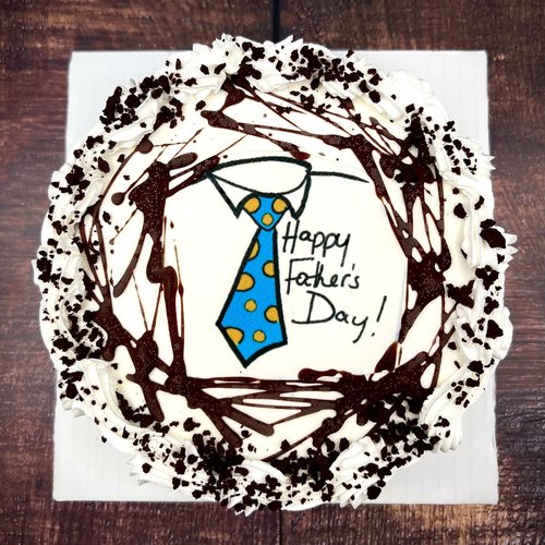 Happy Father&rsquo;s Day ice cream cake with a blue necktie design and chocolate drizzle at Merla-Mae Ice Cream in London, Ontario