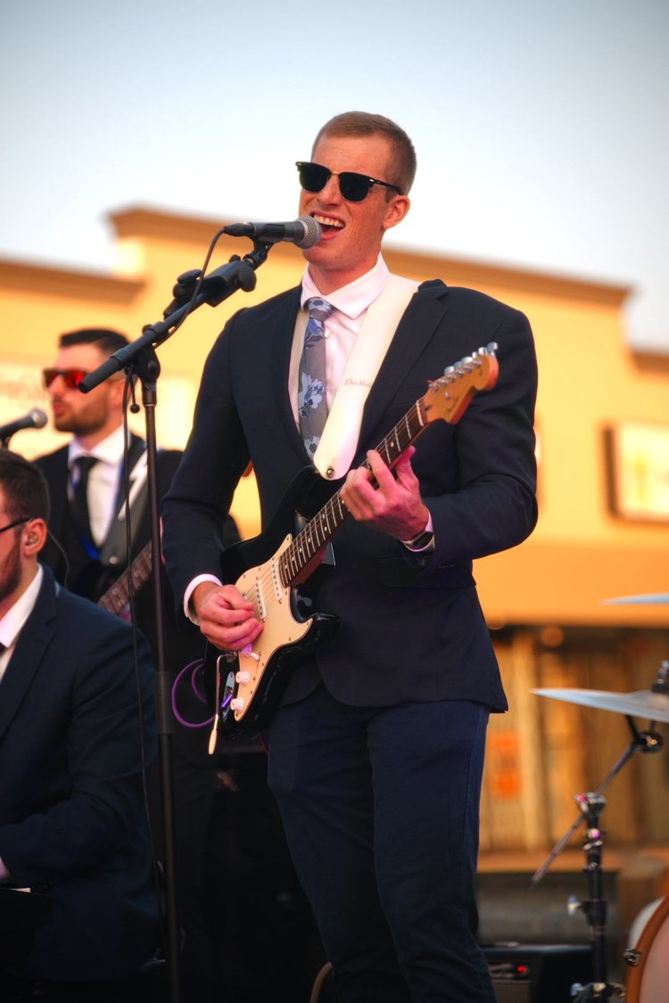 Turning Corners' guitarist performing at National Ice Cream Day 2026, Merla-Mae in London, Ontario