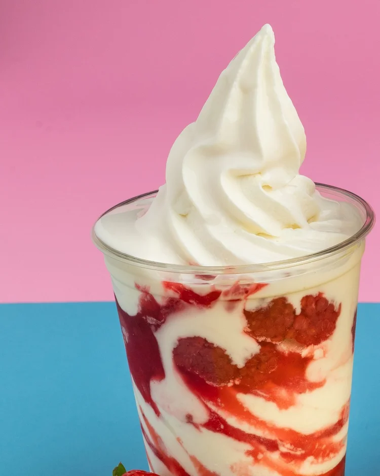 Strawberry parfait with soft-serve swirled with strawberry sauce in a clear cup at Merla-Mae Ice Cream in London, Ontario