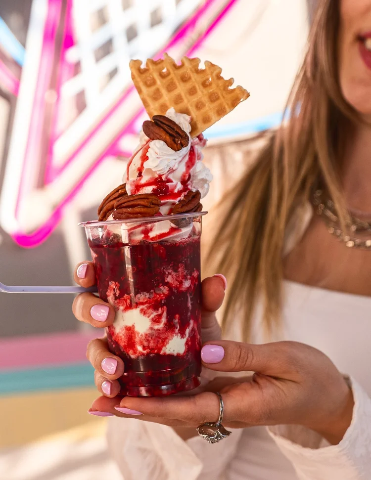 The Berry Luv'ed Parfait with raspberry topping, whipped cream, pecans and a waffle wedge at Merla-Mae Ice Cream in London, Ontario