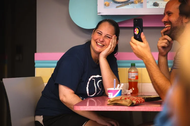 Guests laughing over ice cream during Magician Weekend at Merla-Mae Ice Cream in London, Ontario