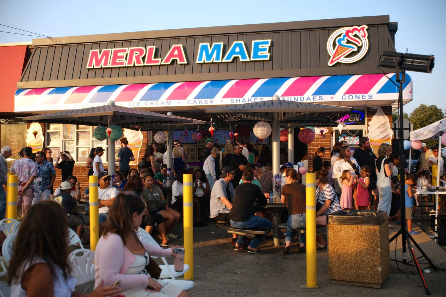 Packed patio in front of the Merla-Mae Ice Cream storefront during National Ice Cream Day 2026 in London, Ontario