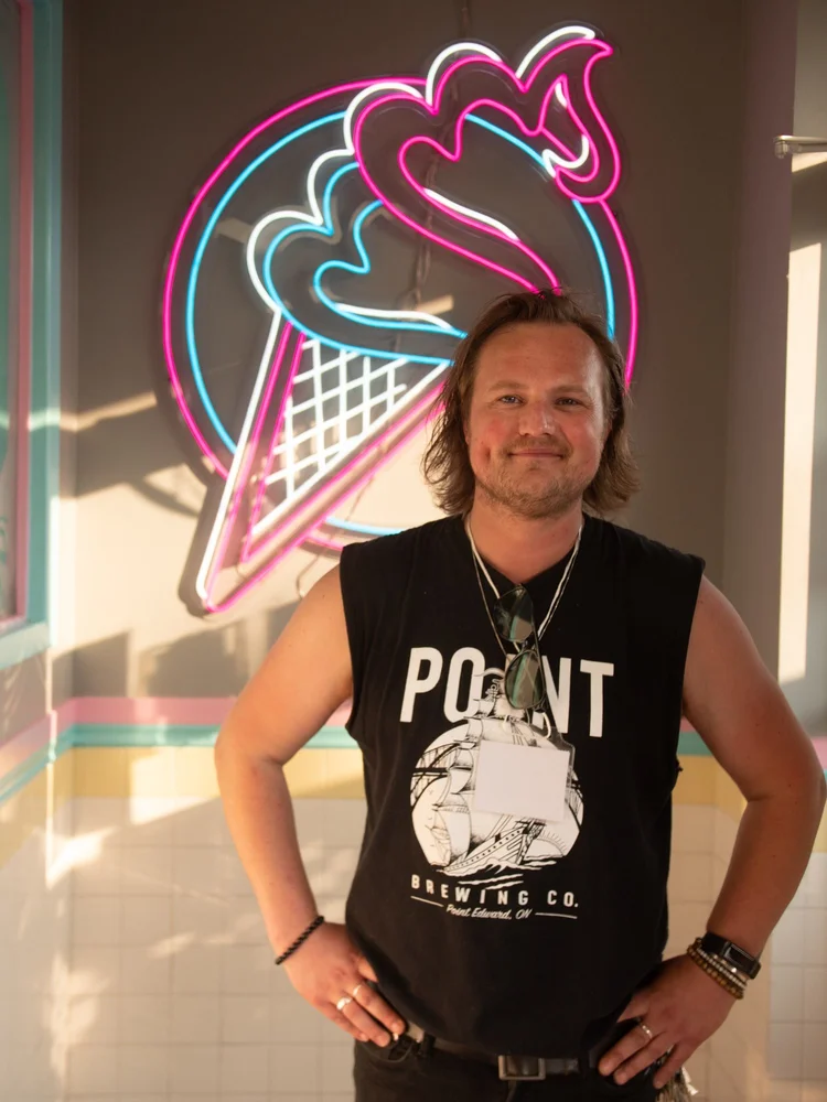 Singer-songwriter Jason Mercer under the neon cone sign at Merla-Mae Ice Cream in London, Ontario