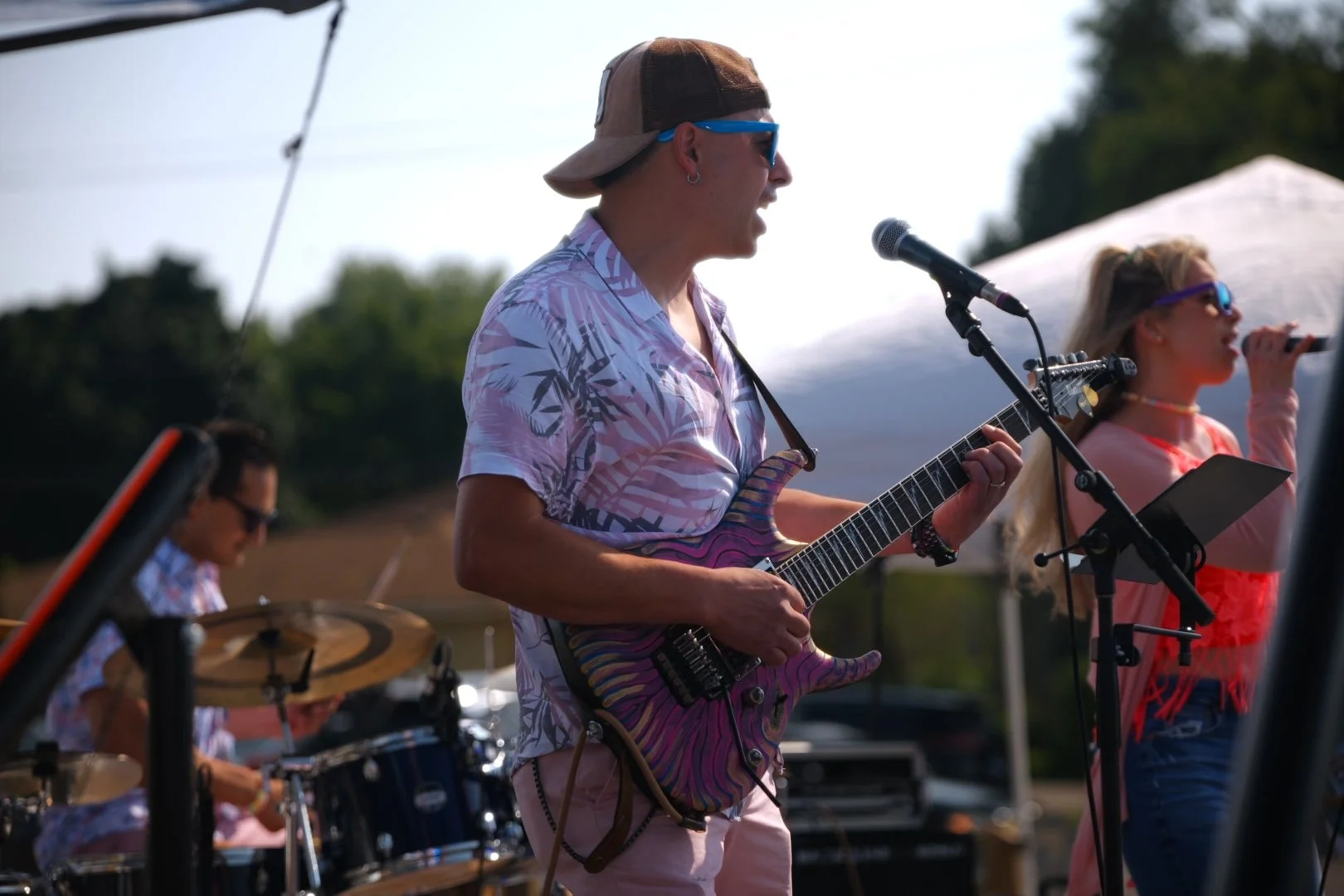 Sweet Theory performing in the afternoon sun at National Ice Cream Day 2026, Merla-Mae