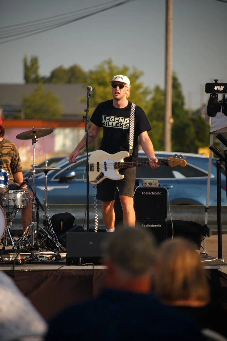 Full Throttle's bassist performing at Merla-Mae's National Ice Cream Day 2026 in London, Ontario