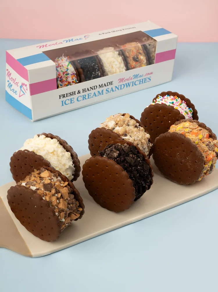 Fresh and hand made ice cream sandwiches rolled in sprinkles, cookie crumbs and candy in front of their 6-pack box at Merla-Mae Ice Cream in London, Ontario