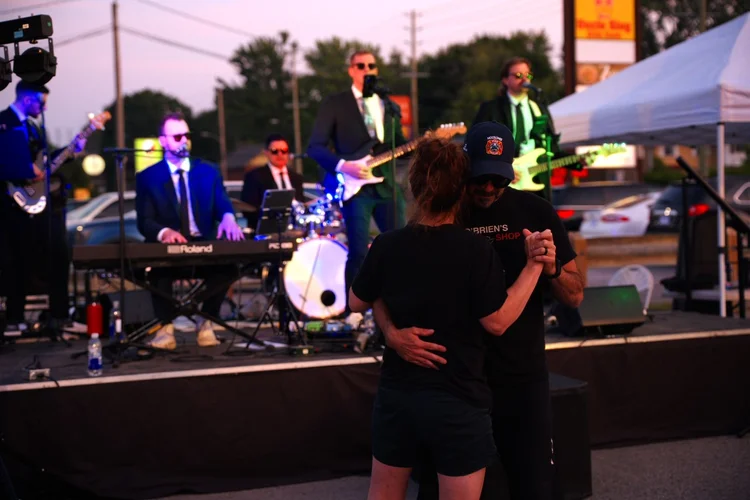 A couple dancing to Turning Corners at Merla-Mae's National Ice Cream Day 2026 in London, Ontario