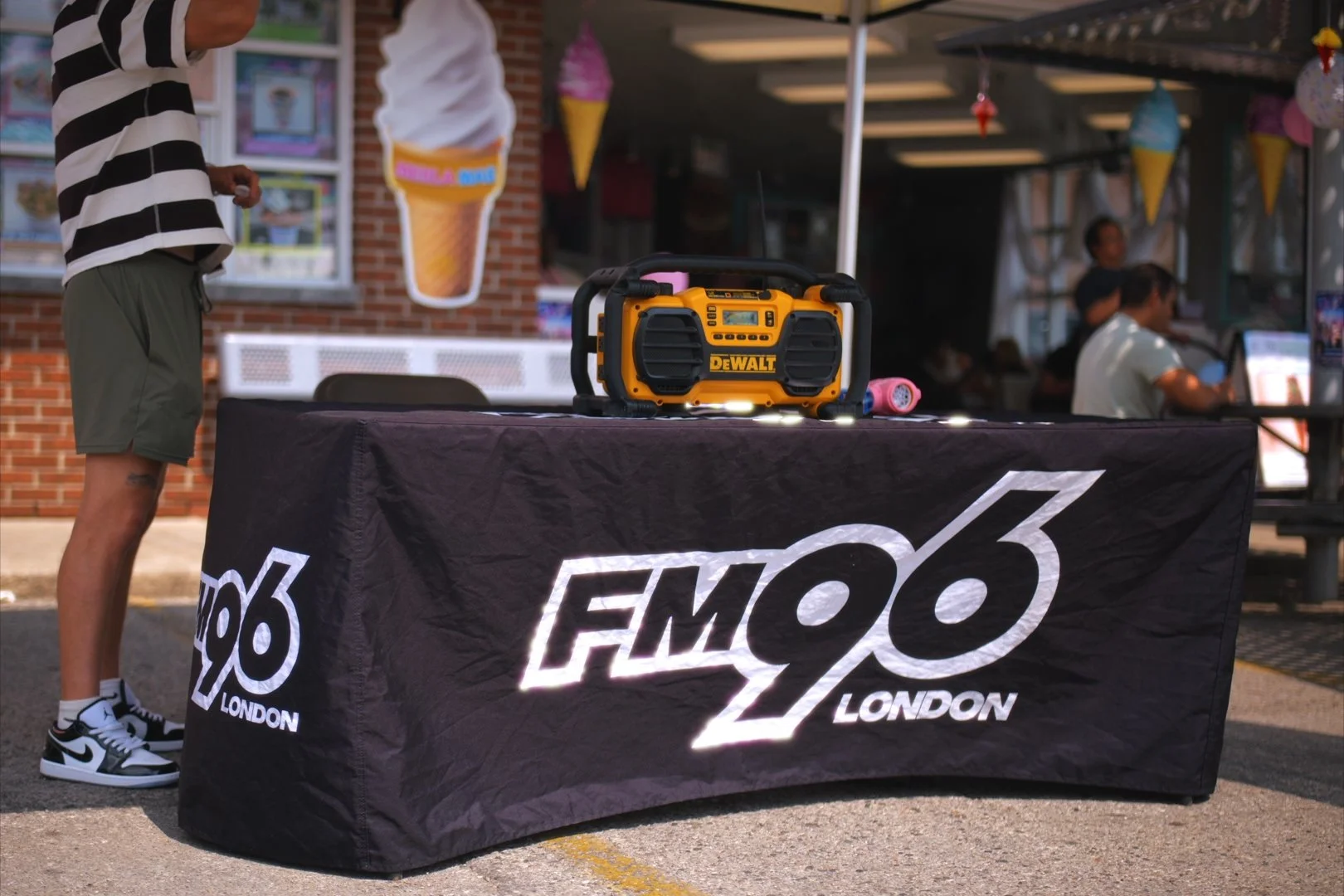 The FM96 London radio booth at Merla-Mae's National Ice Cream Day 2026 in London, Ontario