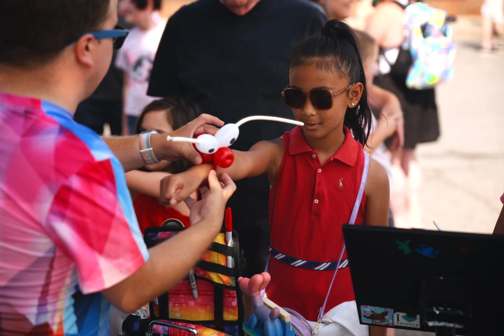Balloon twisting for kids at Merla-Mae's National Ice Cream Day 2026 in London, Ontario