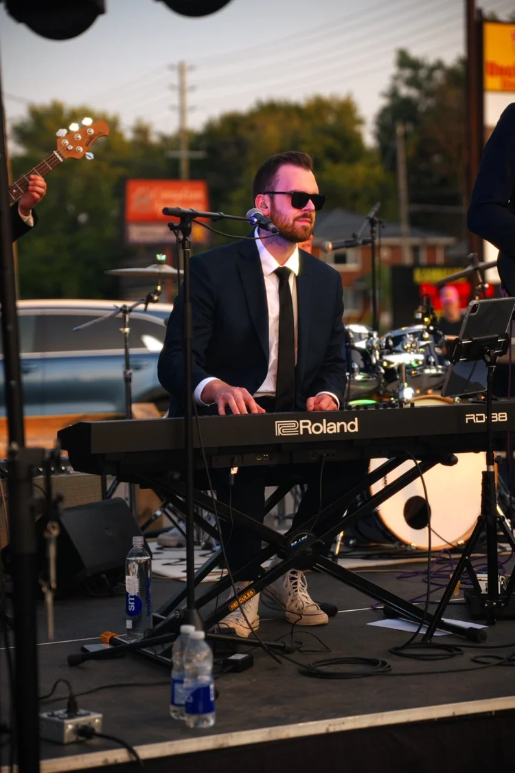 Turning Corners' keyboard player performing at Merla-Mae's National Ice Cream Day 2026