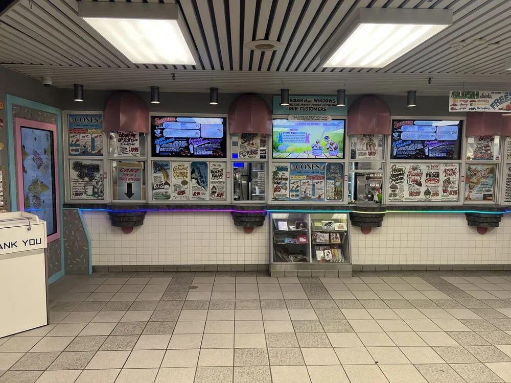 Order windows and menu boards inside Merla-Mae Ice Cream in London, Ontario