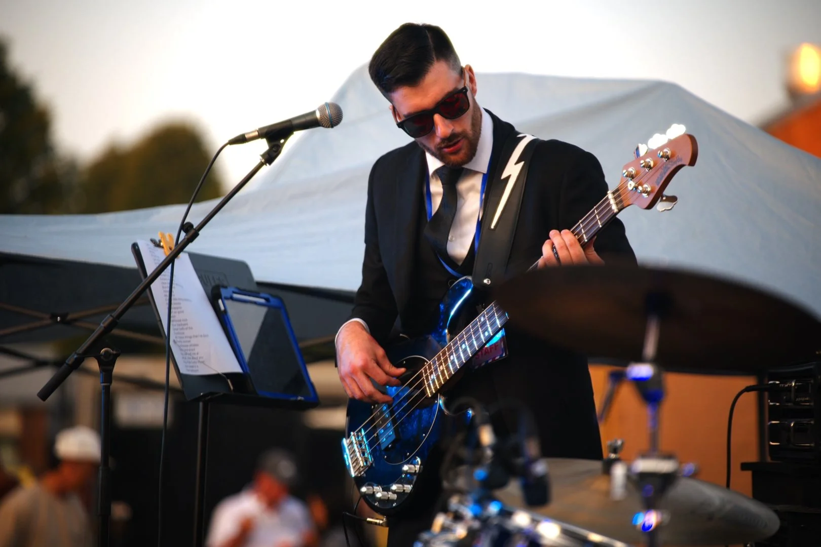 Turning Corners' bass player on stage at Merla-Mae's National Ice Cream Day 2026