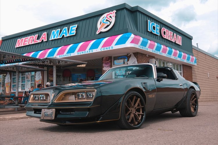 1977 Pontiac Trans Am parked outside Merla-Mae Ice Cream at the Chrome & Cones Car Show