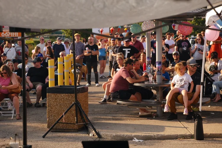 Families at the picnic tables during Merla-Mae's National Ice Cream Day 2026