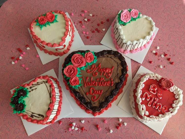 Five heart-shaped ice cream cakes piped with roses, one reading Happy Valentine&rsquo;s Day and one Be Mine, at Merla-Mae Ice Cream in London, Ontario