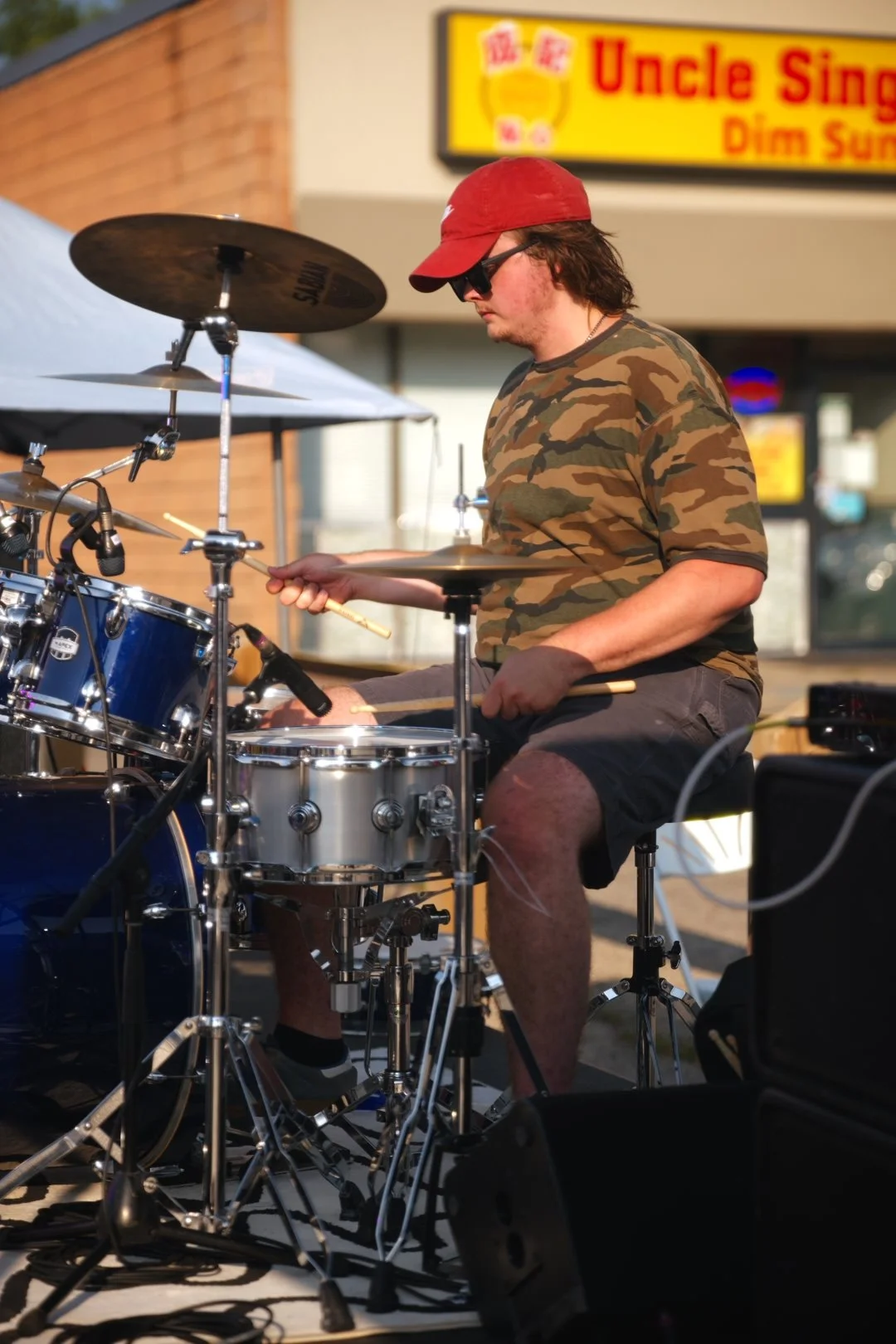 Full Throttle's drummer performing at National Ice Cream Day 2026, Merla-Mae in London, Ontario