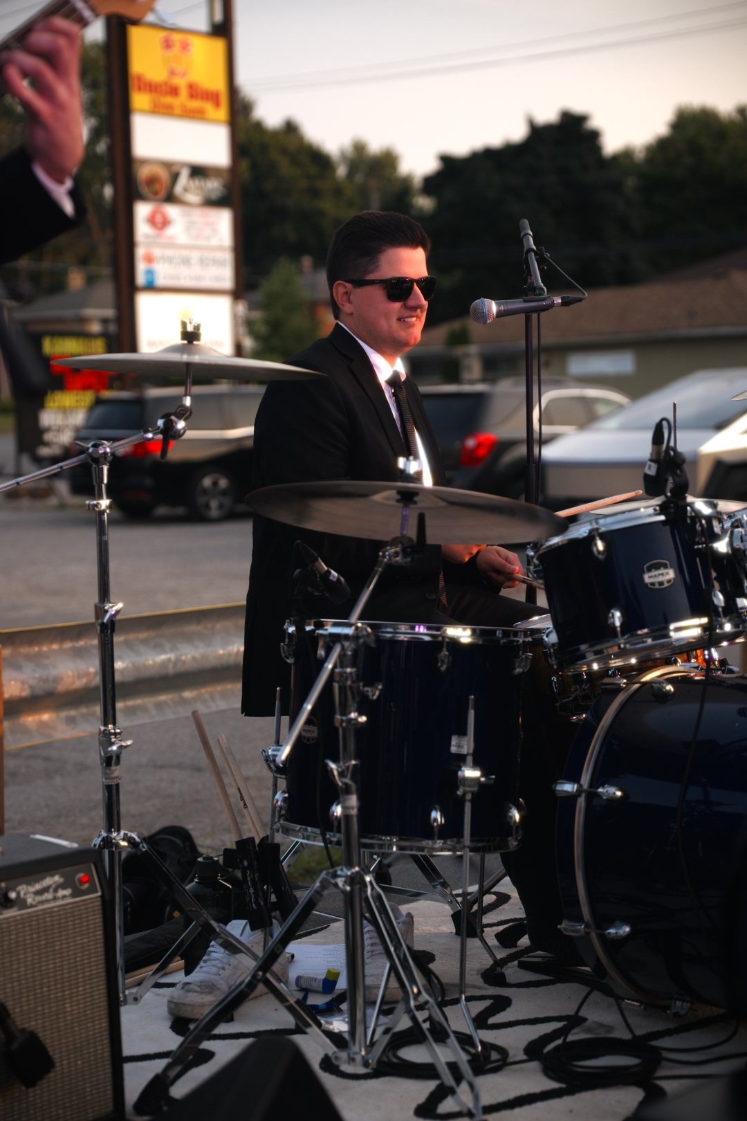 Turning Corners' drummer in the band's signature suit at National Ice Cream Day 2026, Merla-Mae