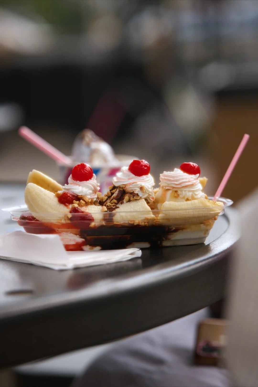 A Merla-Mae banana split with whipped cream, cherries and chocolate syrup served at National Ice Cream Day 2026