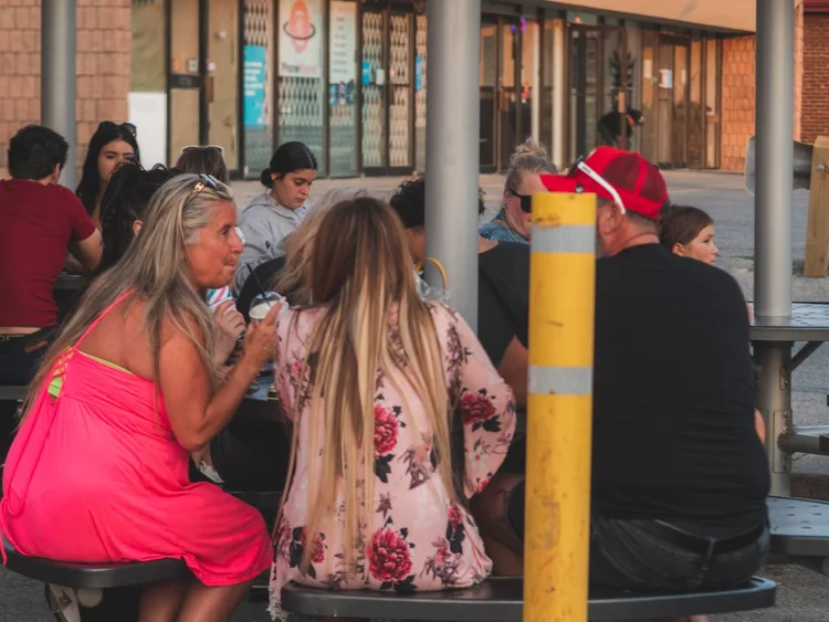 Guests enjoying treats at the patio tables during National Ice Cream Day 2024, Merla-Mae Ice Cream in London, Ontario