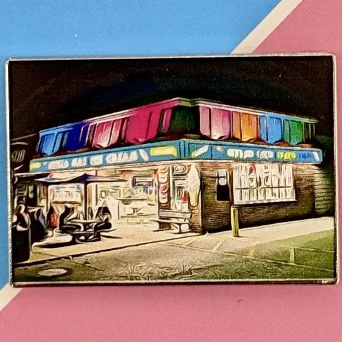 Pin #002 Merla-Mae Ice Cream enamel pin of the painted ice cream store in London, Ontario, on its Pin Collection card