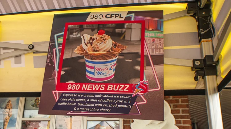 Sign for the 980 News Buzz sundae with 980 CFPL branding at Merla-Mae Ice Cream in London, Ontario, National Ice Cream Day 2025