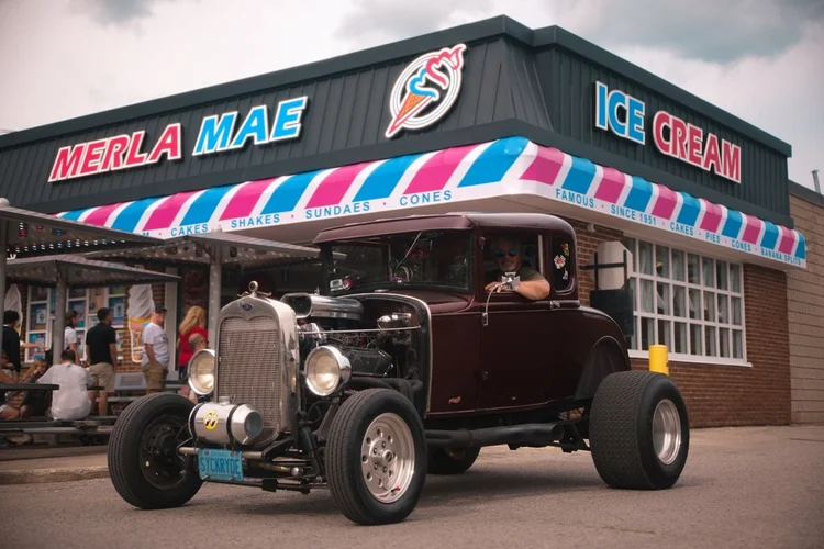 1930 Ford Model A hot rod parked outside Merla-Mae Ice Cream at the Chrome & Cones Car Show