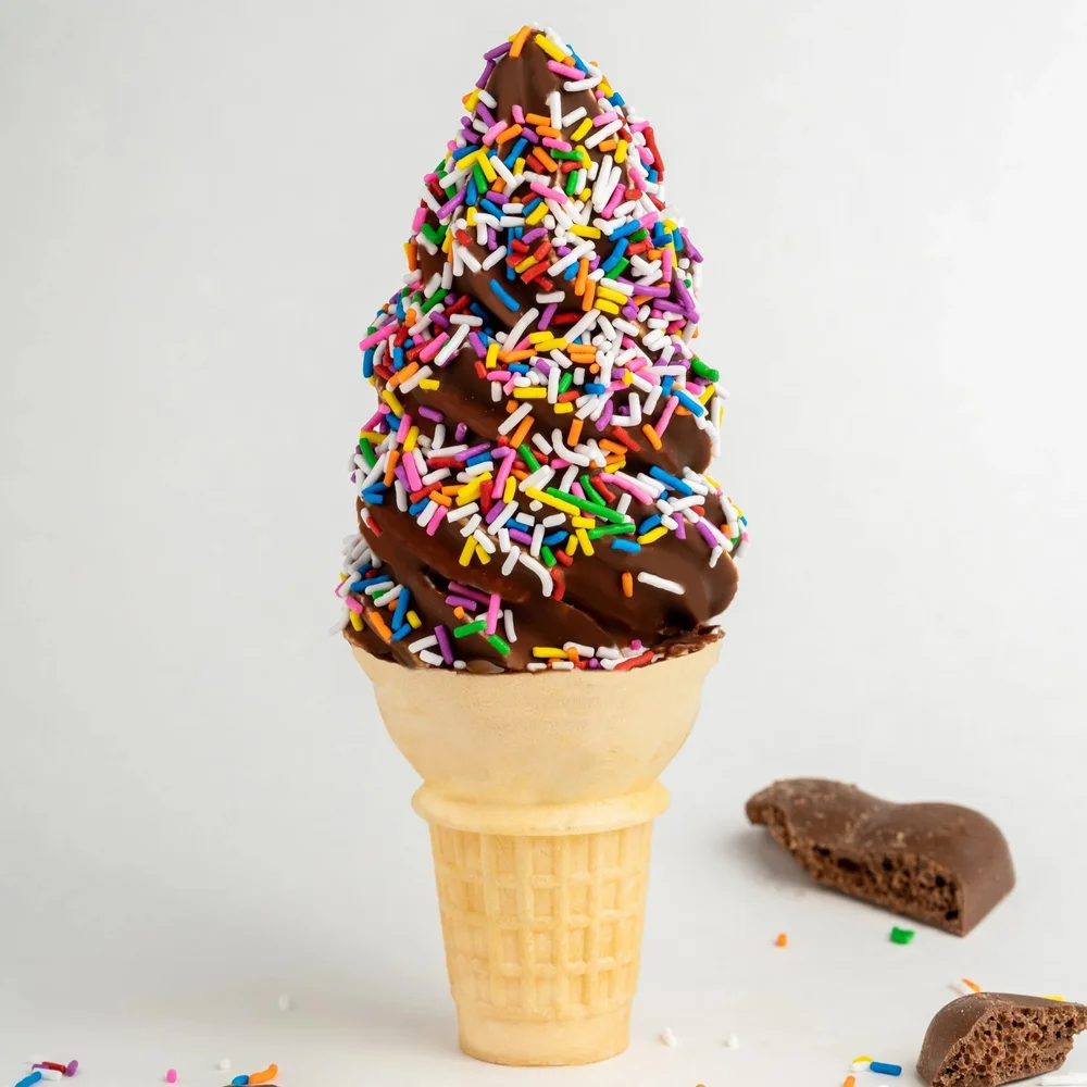 Merla-Mae chocolate dipped cone with sprinkles