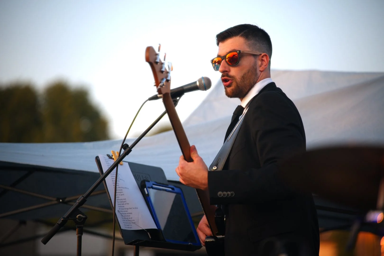 Turning Corners' frontman singing and playing guitar at Merla-Mae's National Ice Cream Day 2026