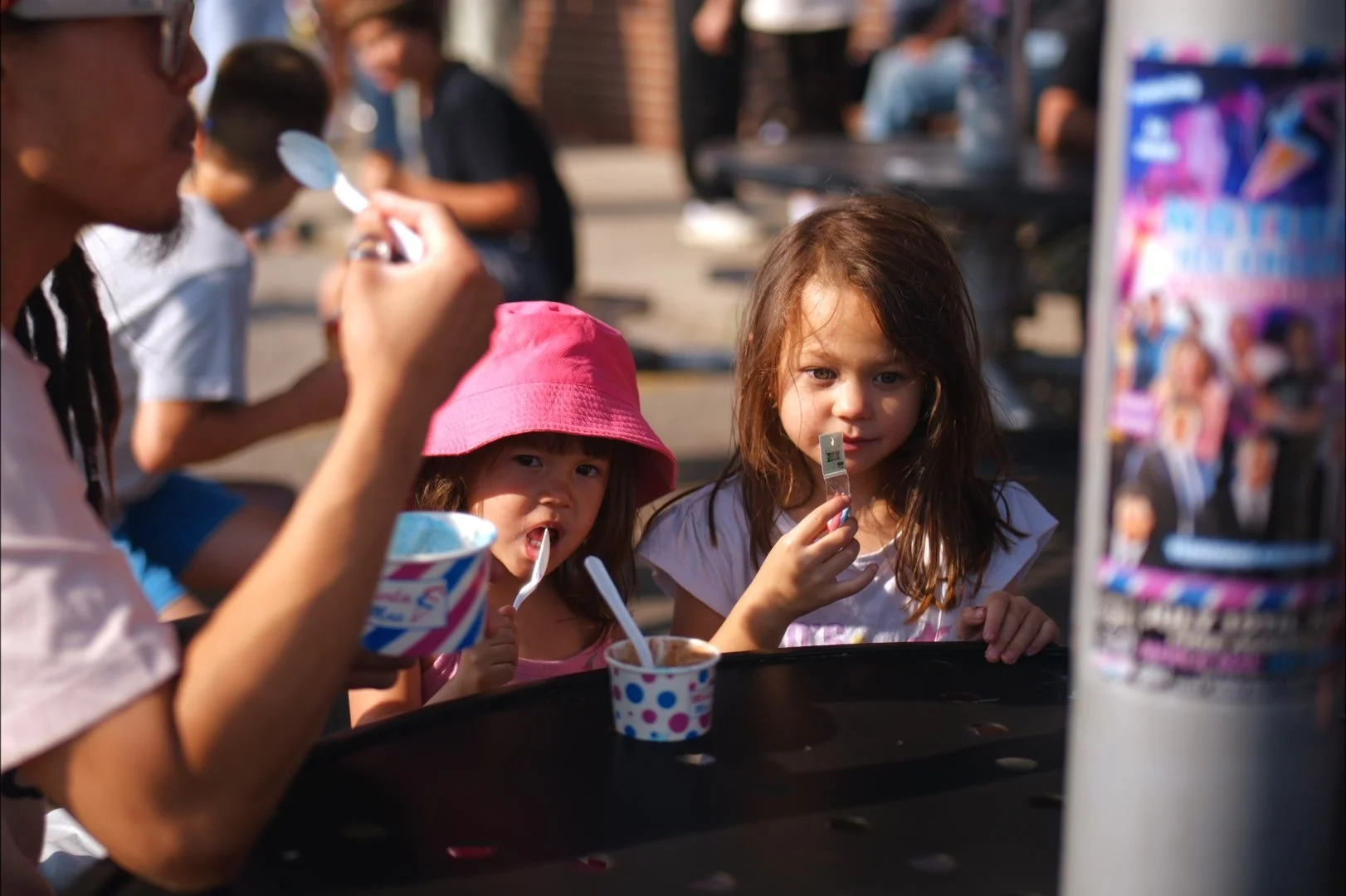 Two young guests enjoying ice cream at Merla-Mae's National Ice Cream Day 2026 in London, Ontario
