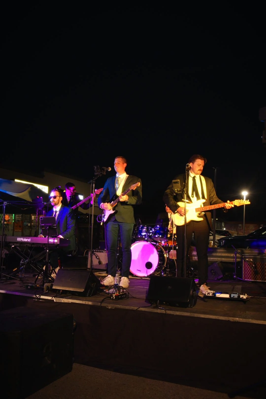 Turning Corners performing after dark at National Ice Cream Day 2026, Merla-Mae in London, Ontario