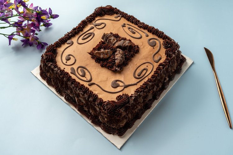 Square ice cream cake with piped chocolate borders and a chocolate swirl on top at Merla-Mae Ice Cream in London, Ontario