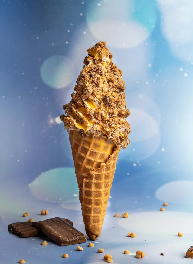Soft-serve dipped in butterscotch and rolled in Skor on a homemade waffle cone at Merla-Mae Ice Cream in London, Ontario