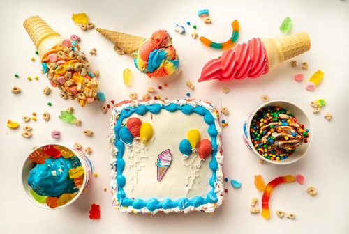Ice cream cake with balloon decorations and cones at Merla-Mae Ice Cream