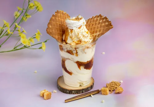 Layered soft-serve parfait with caramel and waffle pieces at Merla-Mae Ice Cream
