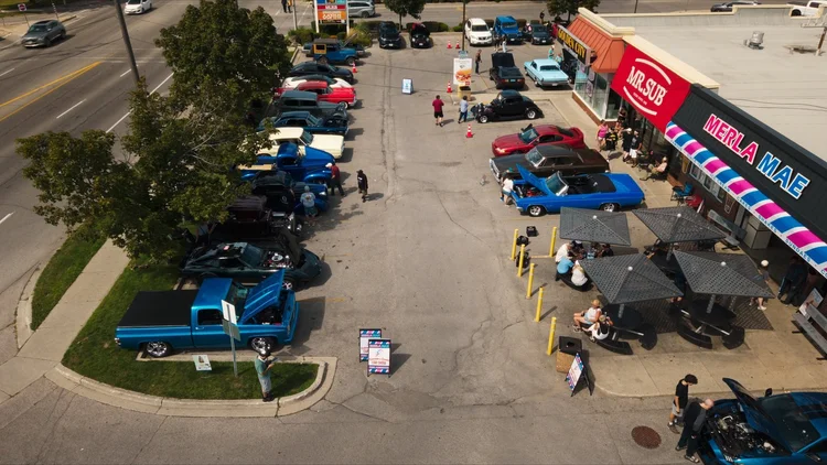 Aerial view of classic cars lined up across the Merla-Mae Ice Cream lot during the Chrome & Cones Car Show in London, Ontario