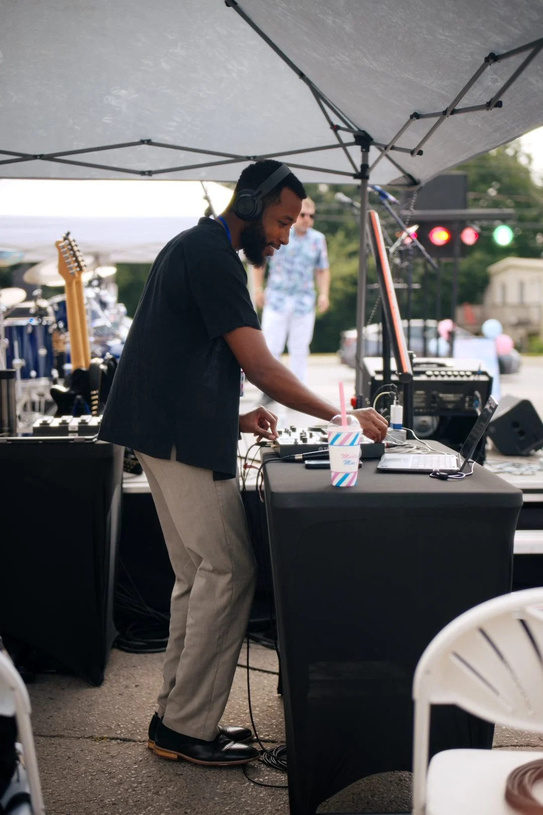 DJ Deem J spinning between sets at National Ice Cream Day 2026, Merla-Mae in London, Ontario