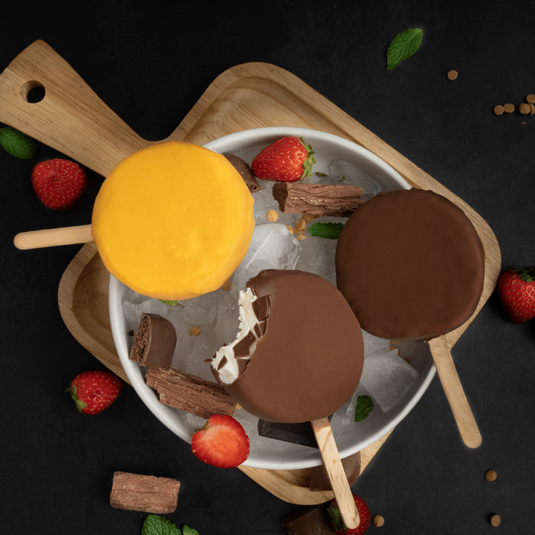 Butterscotch and chocolate Chillin&rsquo; Bars on ice with strawberries at Merla-Mae Ice Cream in London, Ontario
