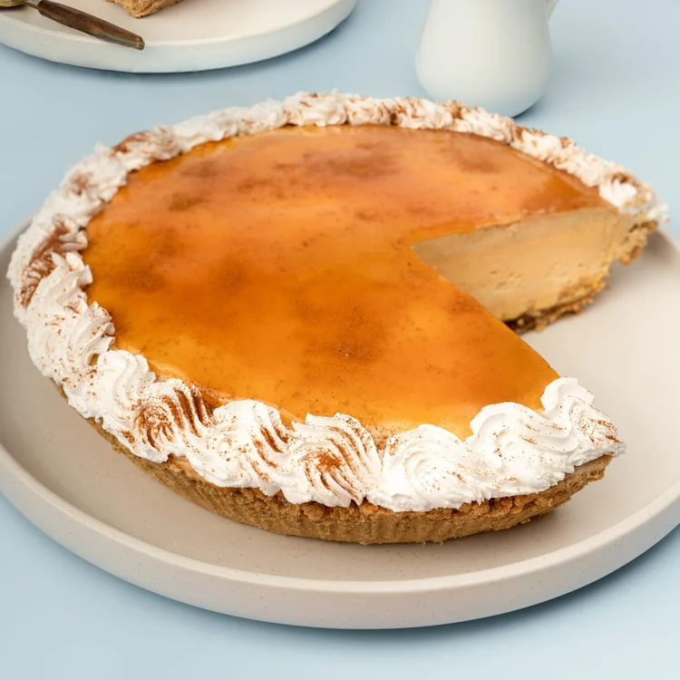 Pumpkin ice cream pie with whipped cream rosettes and a slice cut out at Merla-Mae Ice Cream in London, Ontario