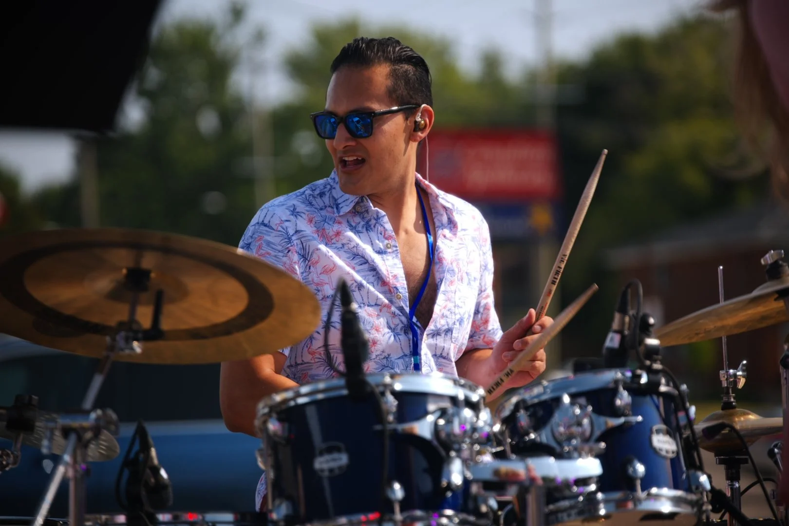 Sweet Theory's drummer performing at Merla-Mae's National Ice Cream Day 2026
