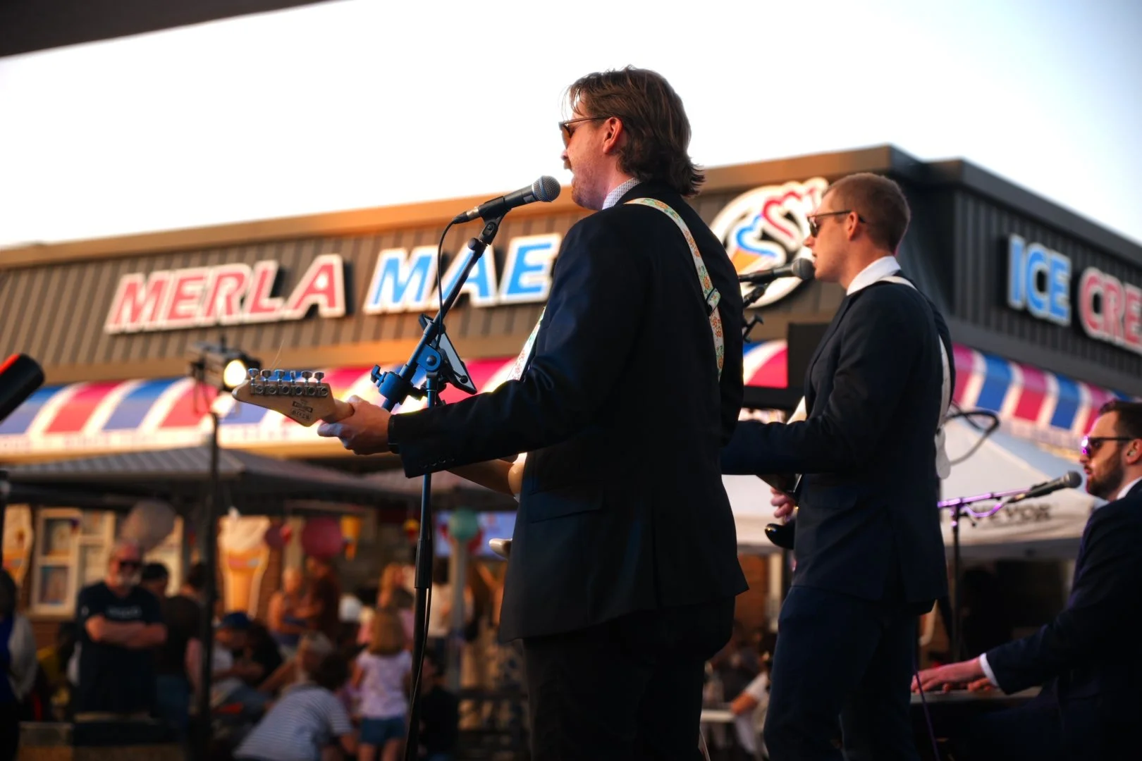 Turning Corners performing outside Merla-Mae Ice Cream during National Ice Cream Day 2026