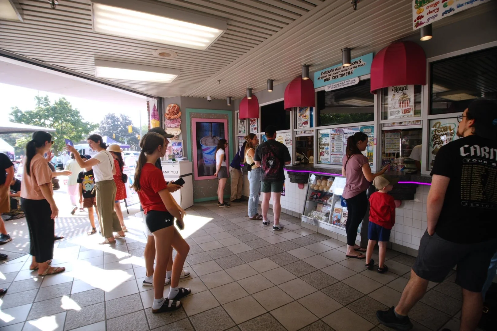 Customers waiting in line for ice cream at Merla-Mae's National Ice Cream Day 2026