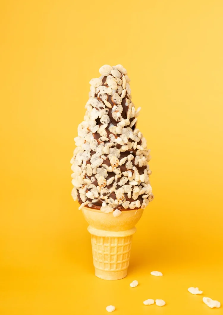 Soft-serve cone dipped in chocolate and rolled in Rice Krispies at Merla-Mae Ice Cream in London, Ontario